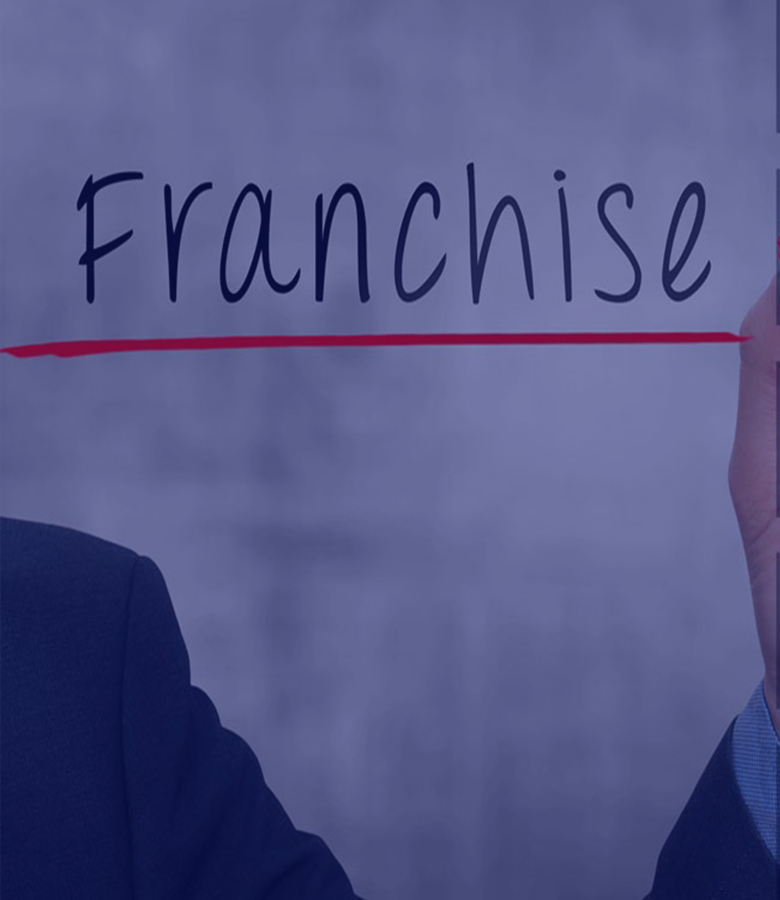 guy with suit wrote franchise and underlined it in red.