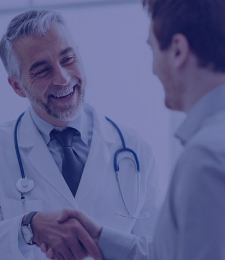 A guy and a doctor handshaking with each other